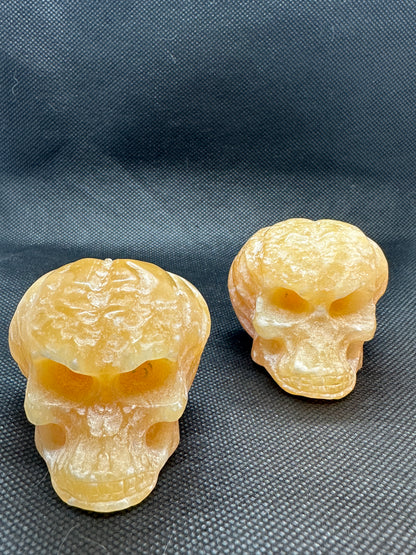 Orange Calcite Skull with Pumpkin Brain Carving