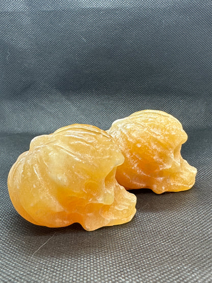 Orange Calcite Skull with Pumpkin Brain Carving