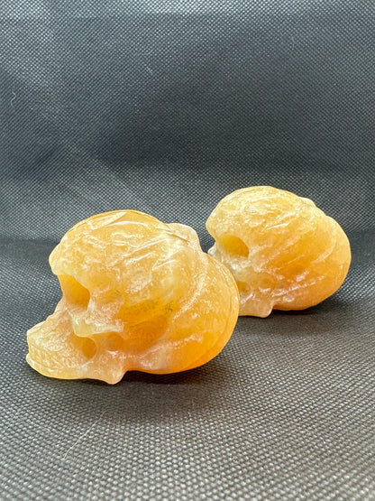 Orange Calcite Skull with Pumpkin Brain Carving