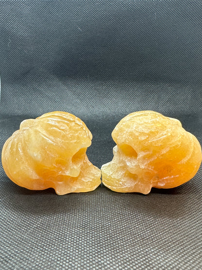 Orange Calcite Skull with Pumpkin Brain Carving