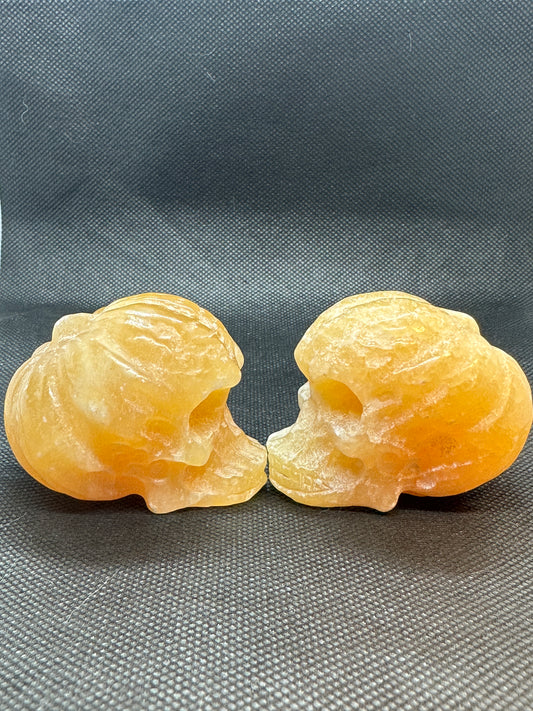 Orange Calcite Skull with Pumpkin Brain Carving